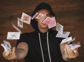 Magician playing with cards as one of many party rentals and performers Magician playing with cards as one of many party rentals and performers